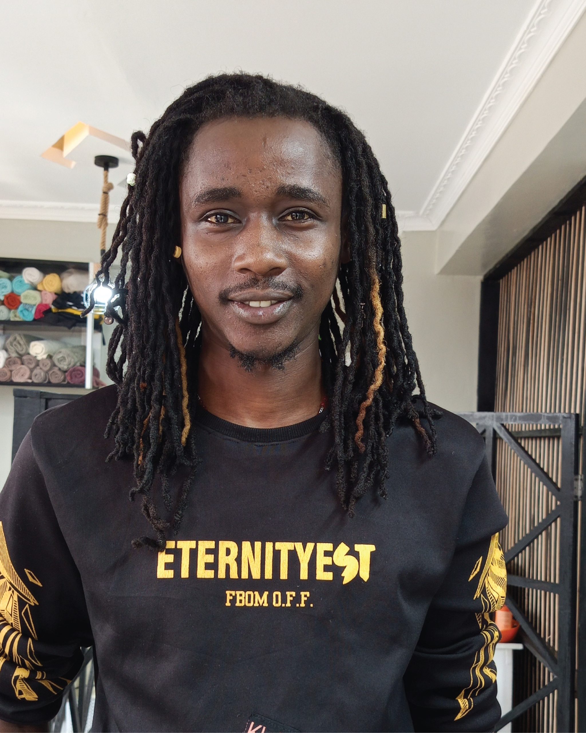Emmanuel Muriuki - Assistant loctician and beautician at Hair By Dee Locs Studio